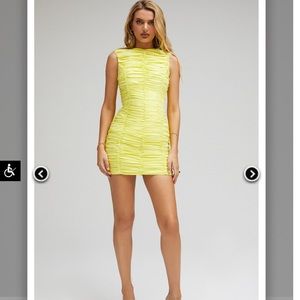 Mistress rocks yellow mini dress.